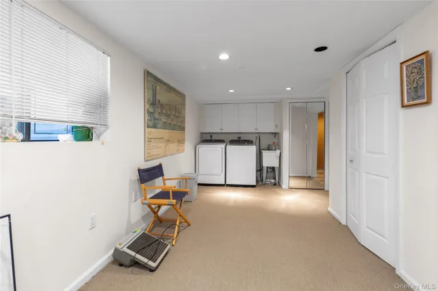a view of a kitchen with a sink and a refrigerator