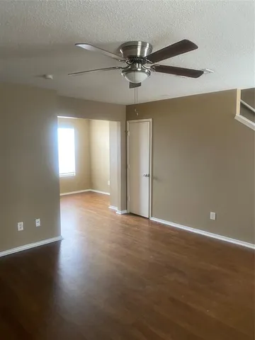 a view of a livingroom with wooden floor