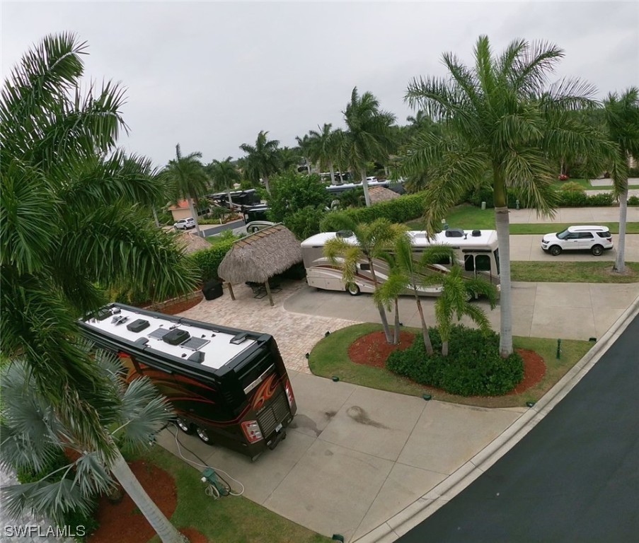 13530 Snook Circle Naples, FL 34114 - Photo 12 of 20 a small pool with couple of relaxing chair