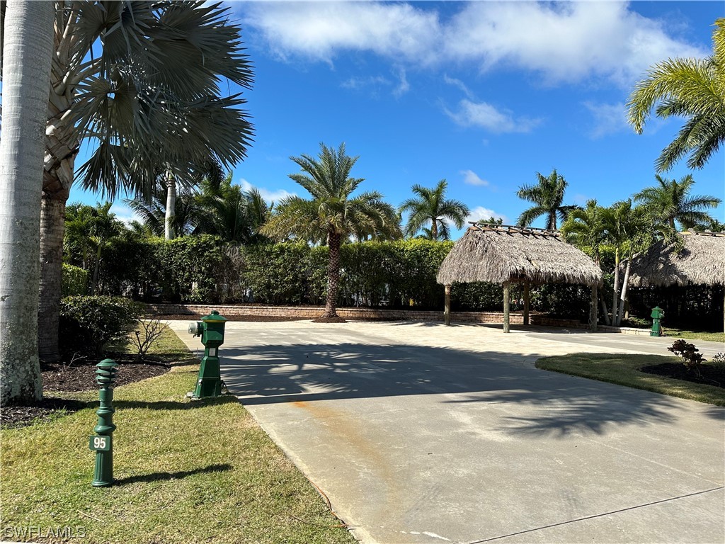13530 Snook Circle Naples, FL 34114 - Photo 4 of 20 a view of a yard and front view of a house