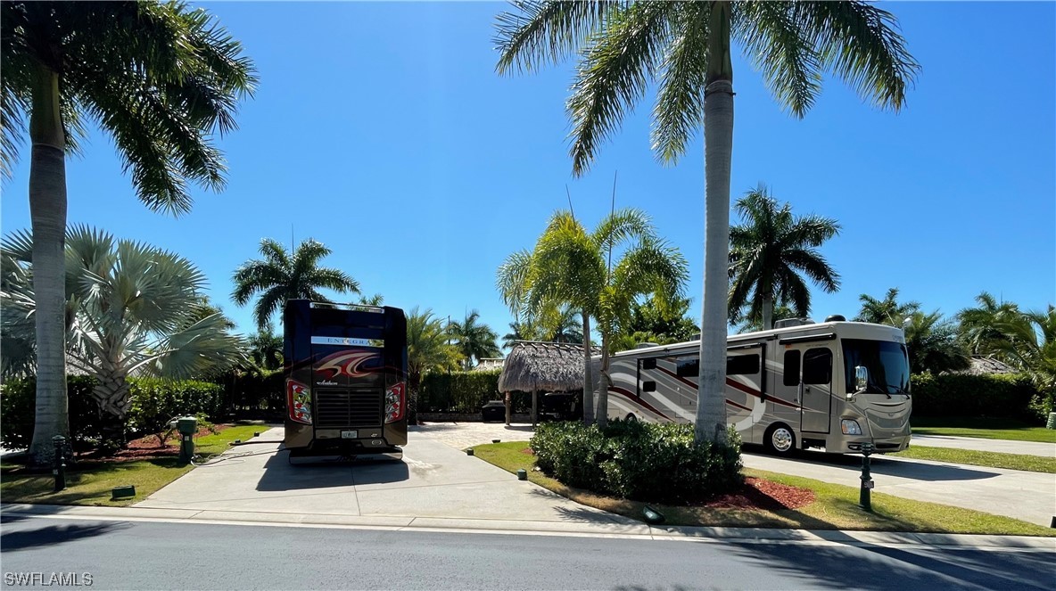 13530 Snook Circle Naples, FL 34114 - Photo 9 of 20 a view of multiple houses with palm trees