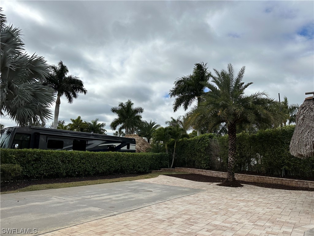 13530 Snook Circle Naples, FL 34114 - Photo 10 of 20 a view of outdoor space with garden