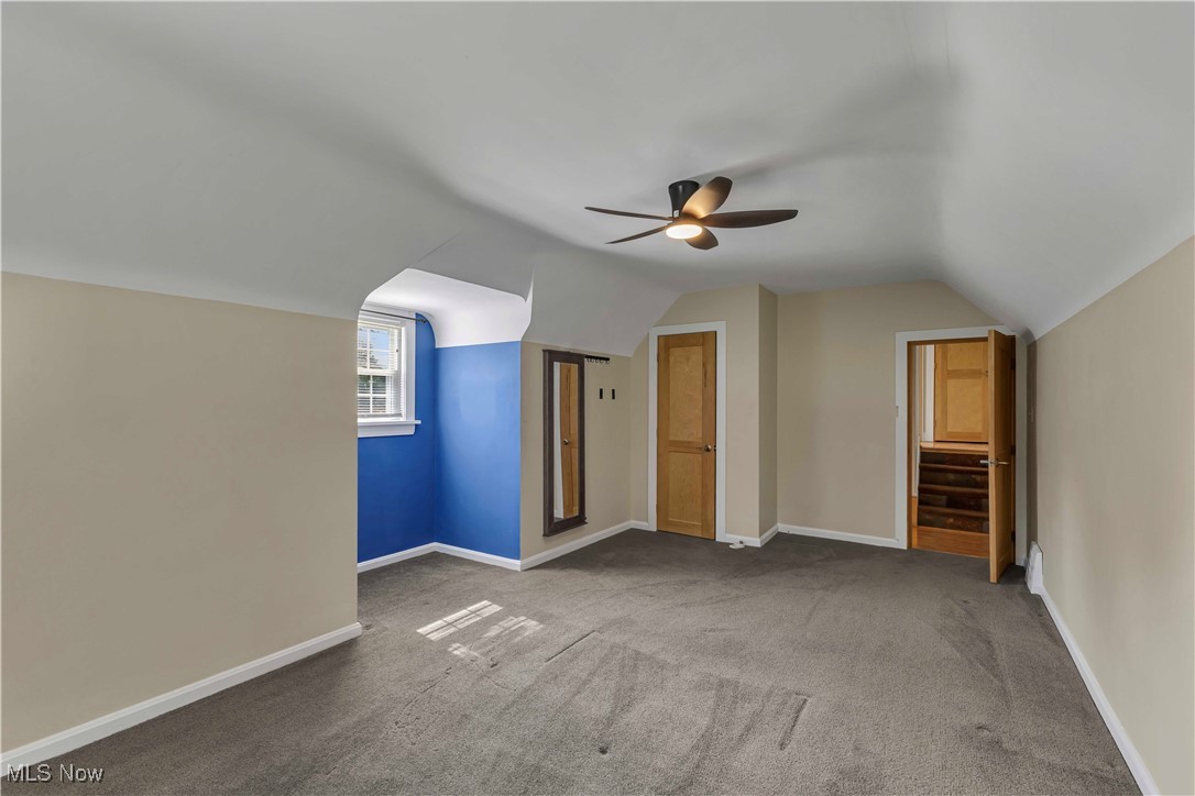15388 Ridge Road North Royalton, OH 44133 - Photo 14 of 45 Bonus room with lofted ceiling, a ceiling fan, and carpet floors