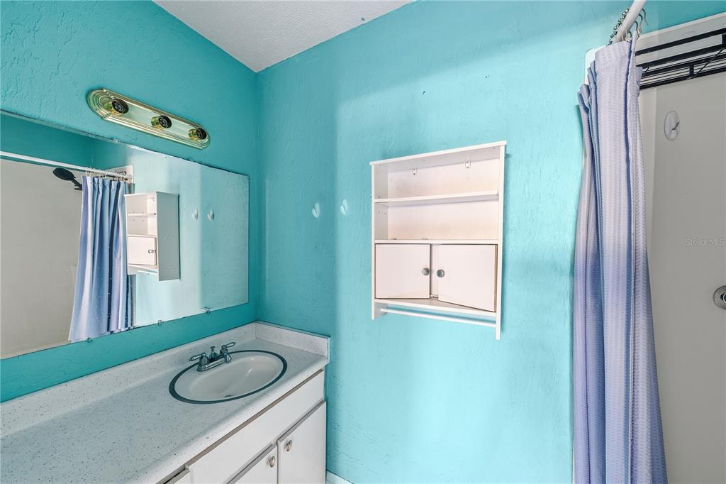 2701 Southwest 15th Street Ocala, FL 34474 - Photo 11 of 38 a bathroom with a granite countertop sink and a mirror