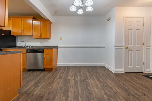 a kitchen with stainless steel appliances granite countertop a stove and a sink