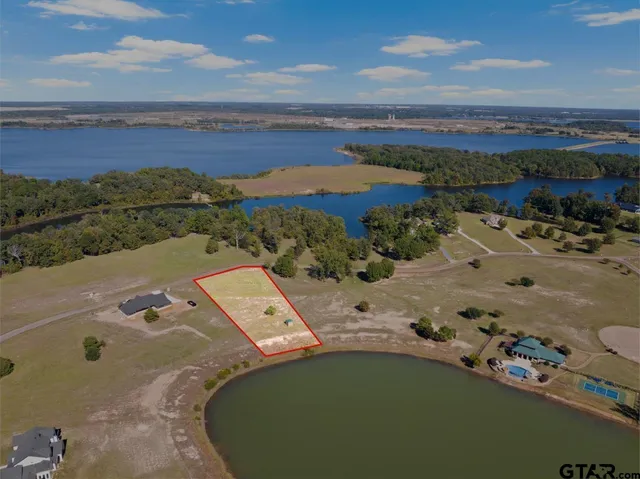an aerial view of a house with a ocean view