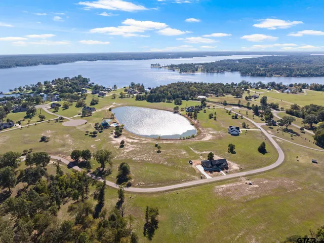 a view of a swimming pool with a yard
