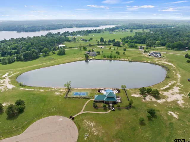 a view of a lake with houses in the back