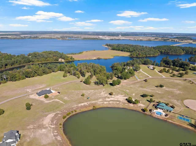 an aerial view of a house with a ocean view