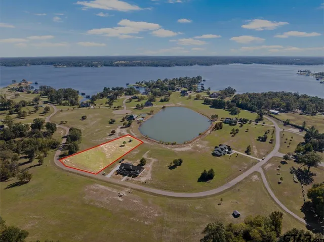an aerial view of a house with outdoor space
