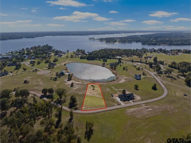 an aerial view of a house with a swimming pool