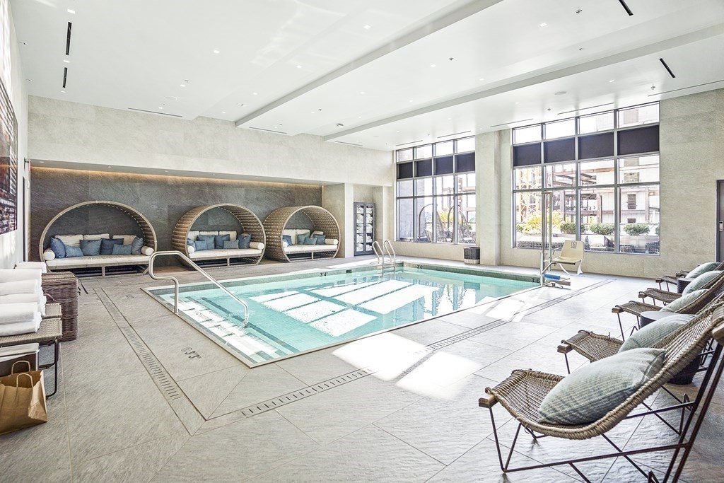 375 Canal Street, Unit 812 Somerville, MA 02145 - Photo 17 of 20 a bedroom with furniture and a window