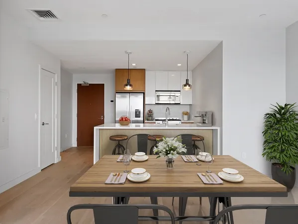 a kitchen with a table and chairs