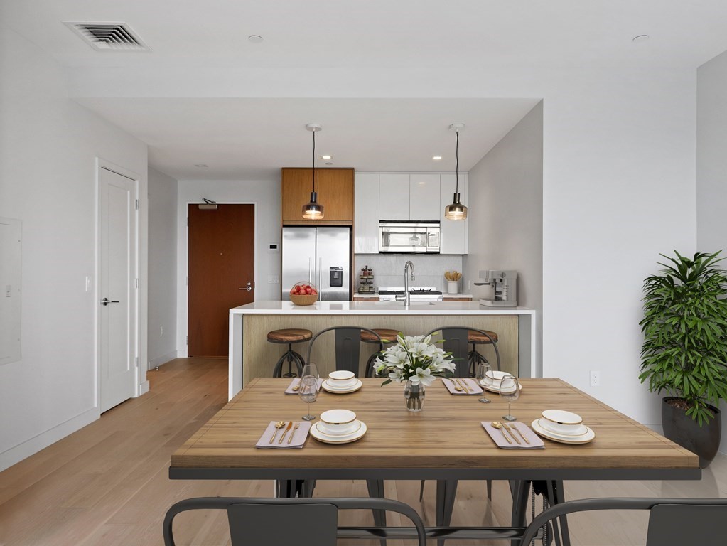 375 Canal Street, Unit 812 Somerville, MA 02145 - Photo 6 of 20 a kitchen with a table and chairs