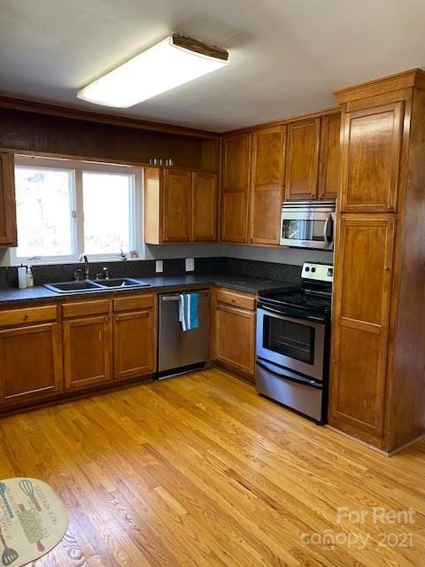 14315 Ramah Church Road Huntersville, NC 28078 - Photo 12 of 32 a kitchen with stainless steel appliances granite countertop a sink stove and refrigerator
