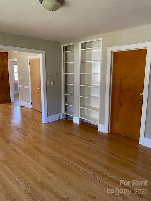 14315 Ramah Church Road Huntersville, NC 28078 - Photo 17 of 32 an empty room with wooden floor and closet