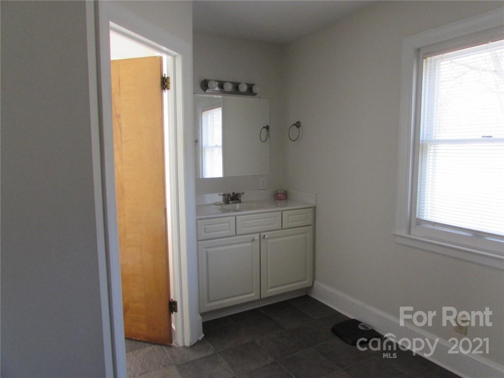 14315 Ramah Church Road Huntersville, NC 28078 - Photo 23 of 32 a bathroom with a sink and a mirror