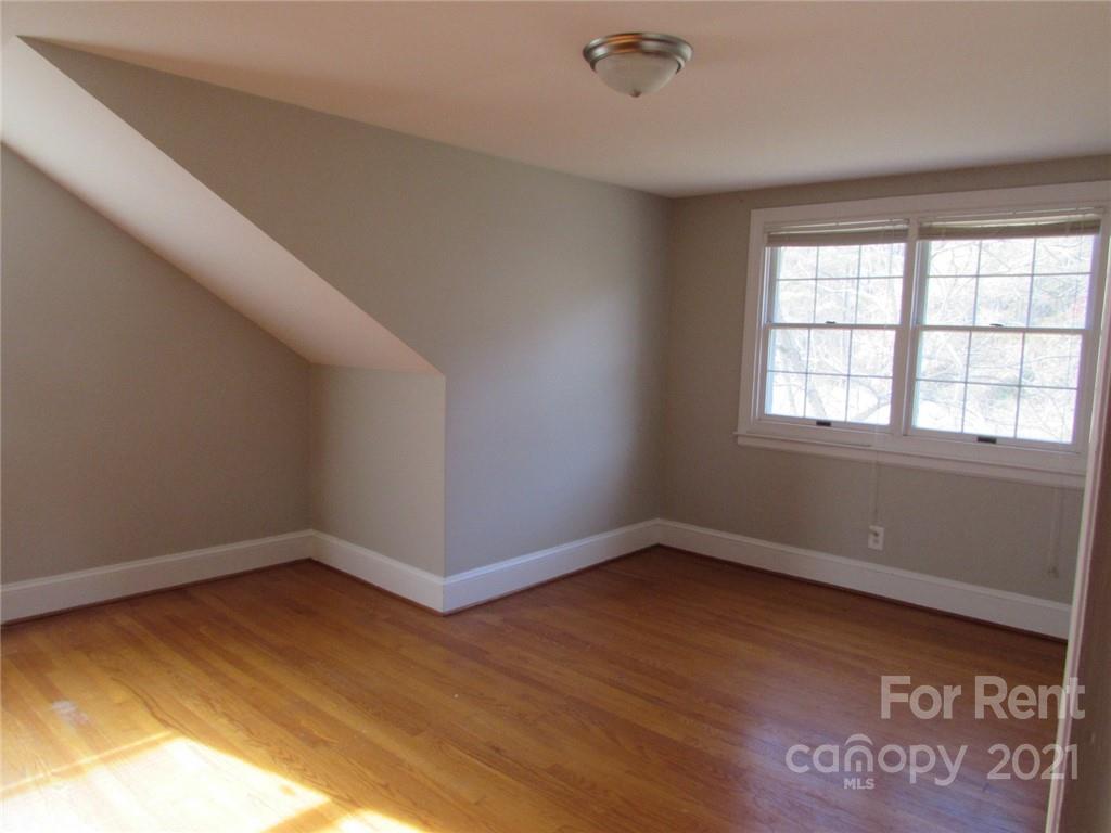 14315 Ramah Church Road Huntersville, NC 28078 - Photo 30 of 32 wooden floor in an empty room with a window