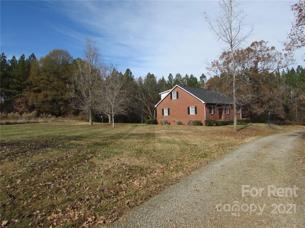 14315 Ramah Church Road Huntersville, NC 28078 - Photo 4 of 32 a front view of a house with a yard