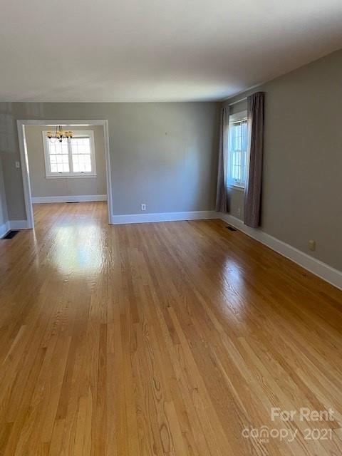 14315 Ramah Church Road Huntersville, NC 28078 - Photo 7 of 32 a view of empty room with window and wooden floor