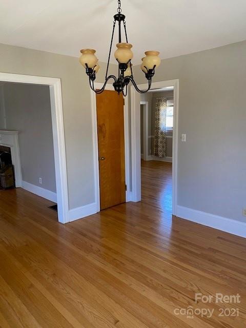 14315 Ramah Church Road Huntersville, NC 28078 - Photo 10 of 32 a view of a room with wooden floor staircase and a chandelier