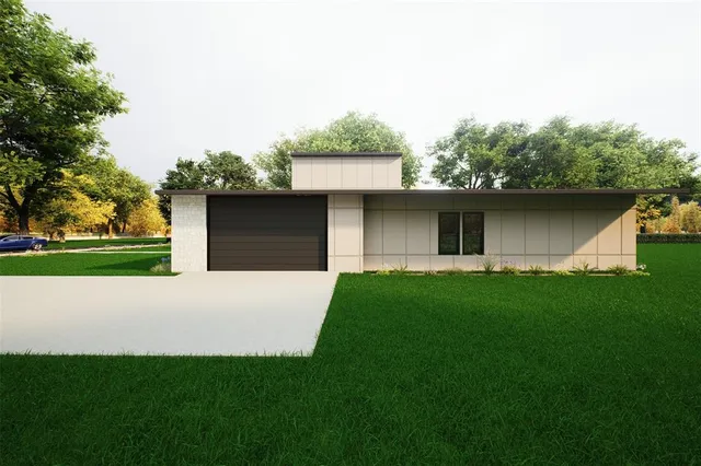 a front view of house with yard and trees