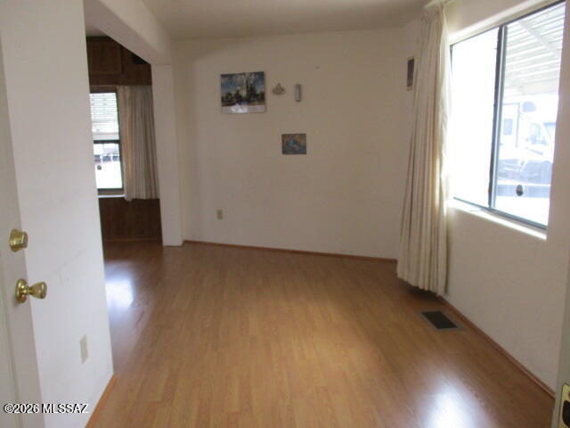 3100 South Kinney Road, Unit 193 Tucson, AZ 85713 - Photo 7 of 35 an empty room with windows