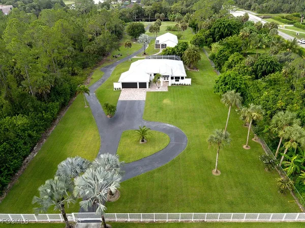 a view of a swimming pool with a yard