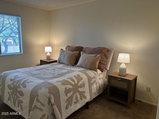 7234 East Cave Creek Road, Unit 115 Cave Creek, AZ 85331 - Photo 6 of 6 a bedroom with a bed and a lamp