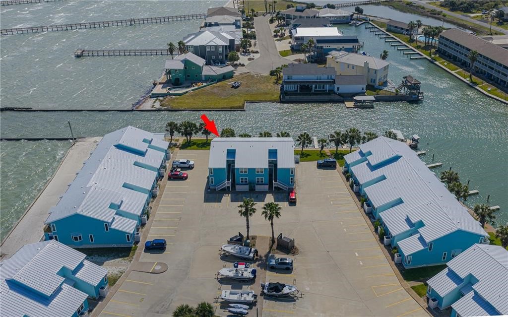 2292 North Fulton Beach Road, Unit 405 Rockport, TX 78382 - Photo 2 of 40 an aerial view of a house with a yard
