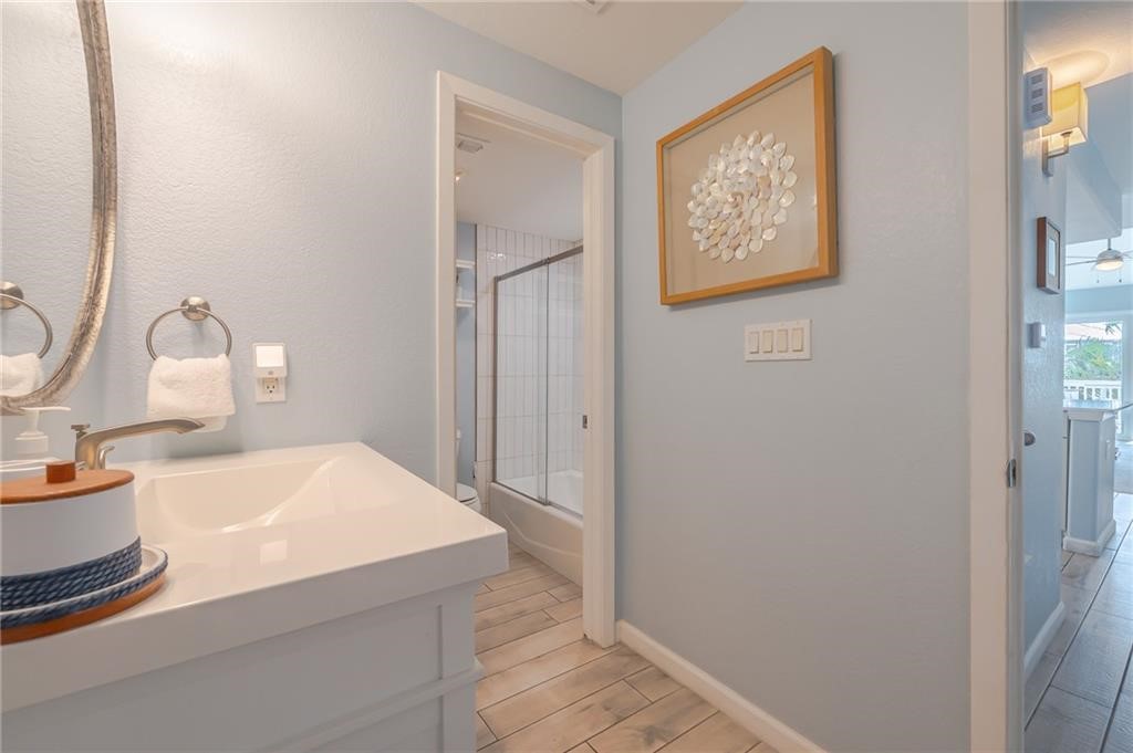 2292 North Fulton Beach Road, Unit 405 Rockport, TX 78382 - Photo 21 of 40 a bathroom with a sink and a mirror