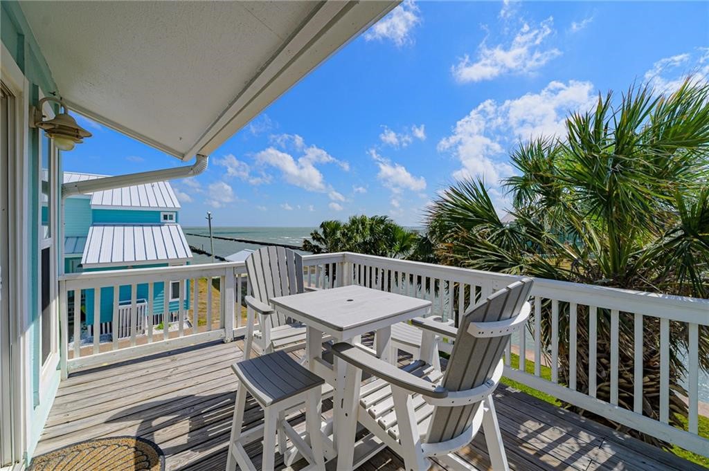 2292 North Fulton Beach Road, Unit 405 Rockport, TX 78382 - Photo 30 of 40 a view of a balcony with chairs