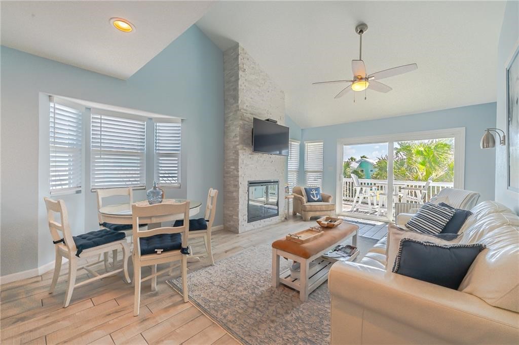 2292 North Fulton Beach Road, Unit 405 Rockport, TX 78382 - Photo 3 of 40 a living room with furniture and a large window