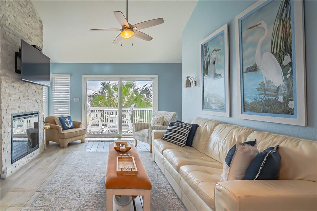 2292 North Fulton Beach Road, Unit 405 Rockport, TX 78382 - Photo 4 of 40 a living room with furniture and a large window