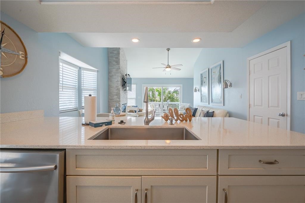 2292 North Fulton Beach Road, Unit 405 Rockport, TX 78382 - Photo 10 of 40 a living room with kitchen island furniture and a large window