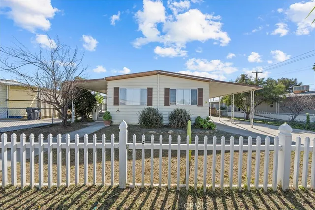 a view of a house with wooden deck
