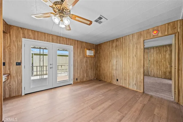 a view of a kitchen with wooden floor and a sink