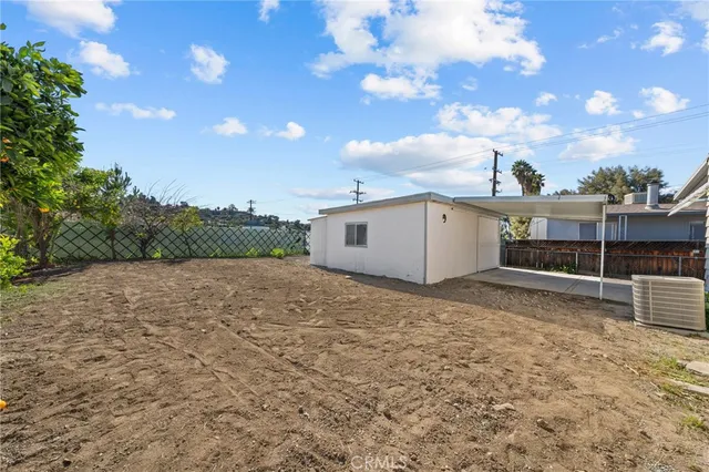 a big house with a big yard and large trees