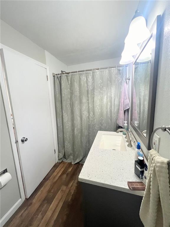 1039 State Avenue, Unit 1039 Coraopolis, PA 15108 - Photo 4 of 6 a bathroom with a sink a toilet and a mirror