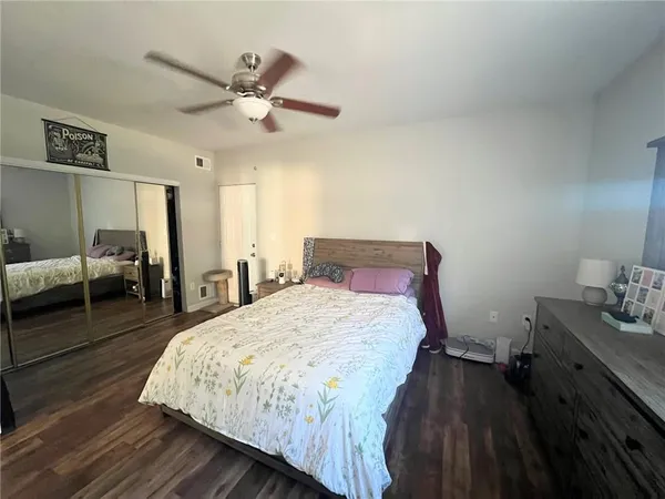 a bedroom with bed and window