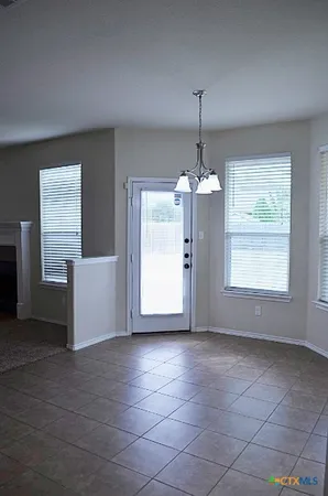 a view of a kitchen with a sink and dishwasher cabinets