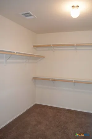 a view of small space with racks on the wall