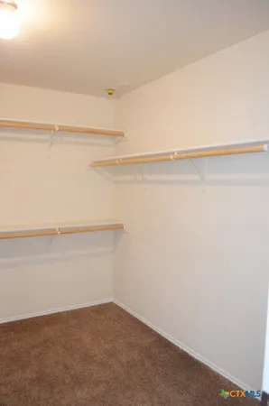 a view of small space with racks on the wall