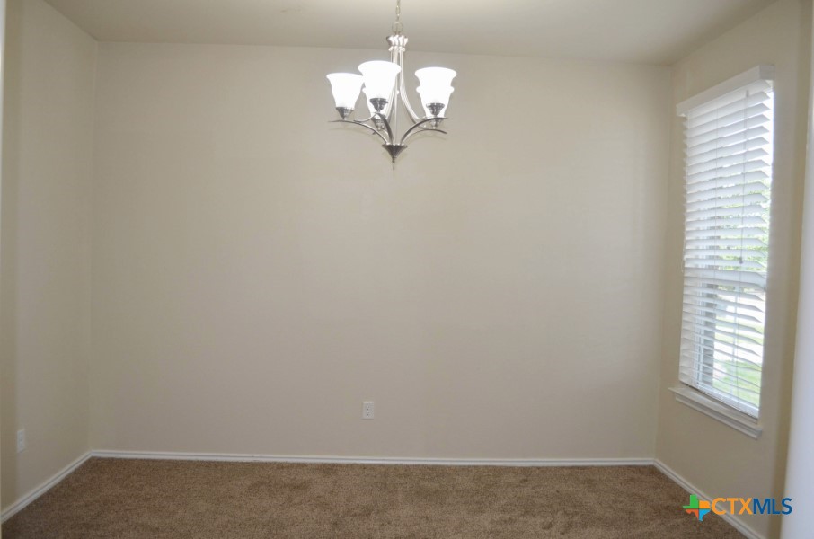 4808 Green Meadow Street Killeen, TX 76549 - Photo 7 of 46 a view of a small space with chandelier fan and a window