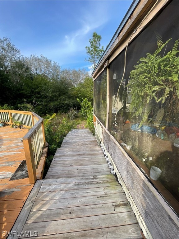 5320 8th Street Clewiston, FL 33440 - Photo 14 of 18 a view of balcony with wooden floor and lake view
