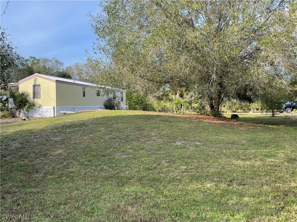 5320 8th Street Clewiston, FL 33440 - Photo 17 of 18 a view of a back yard of the house