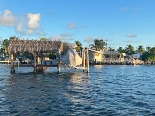 1319 Calder Road Key Largo, FL 33037 - Photo 4 of 78 View of chickee, dock and boat lift angl