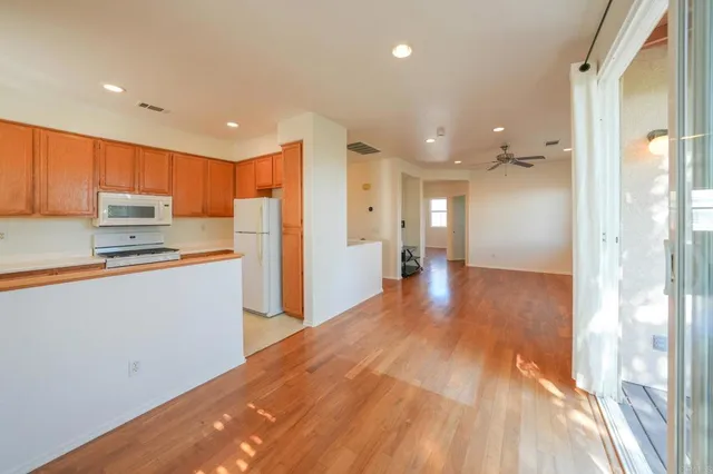 a view of a kitchen from the hallway