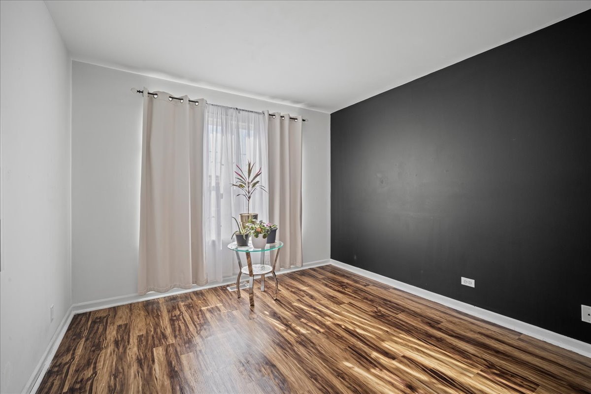 345 Kestrel Lane Lindenhurst, IL 60046 - Photo 15 of 24 a view of room with wooden floor