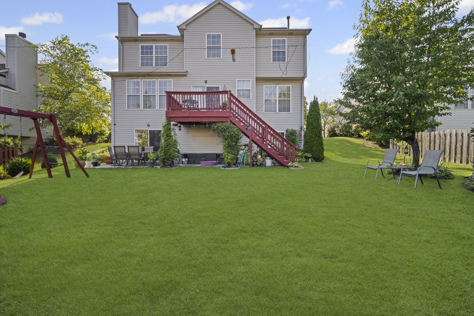 345 Kestrel Lane Lindenhurst, IL 60046 - Photo 18 of 24 a view of a house with a big yard and large trees